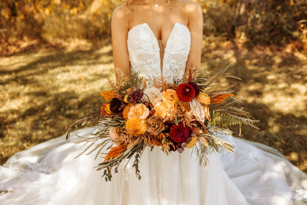 bride posing with her bridal bouquet