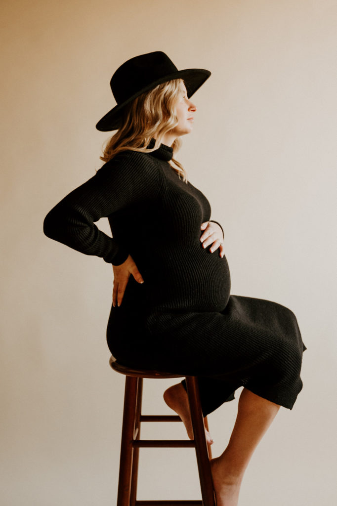 girl posing for her studio maternity photoshoot