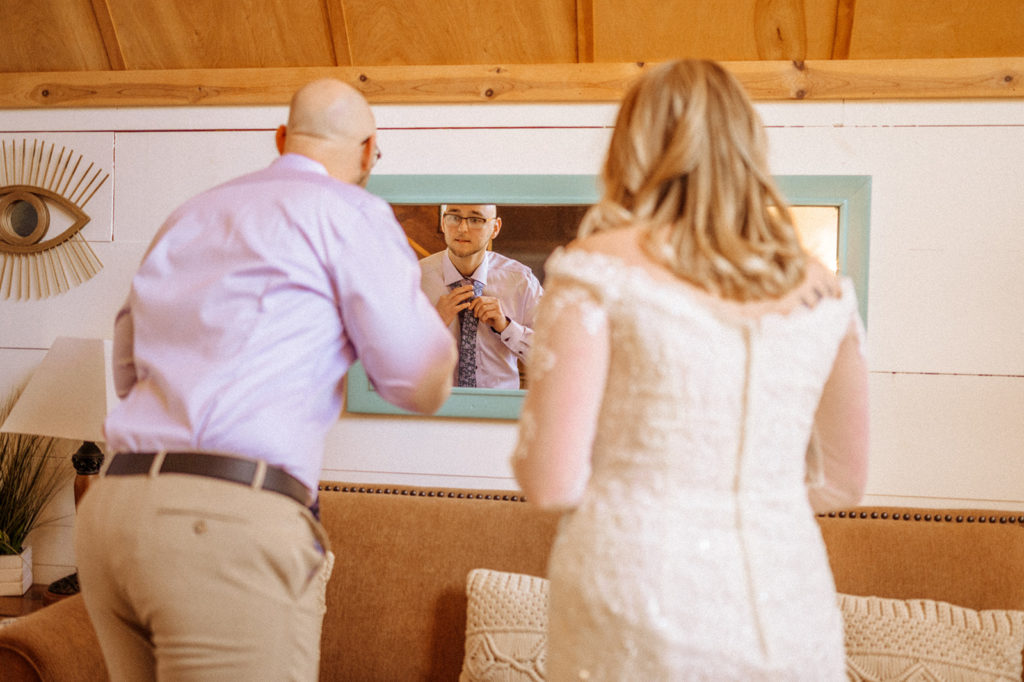 groom getting ready before elopement