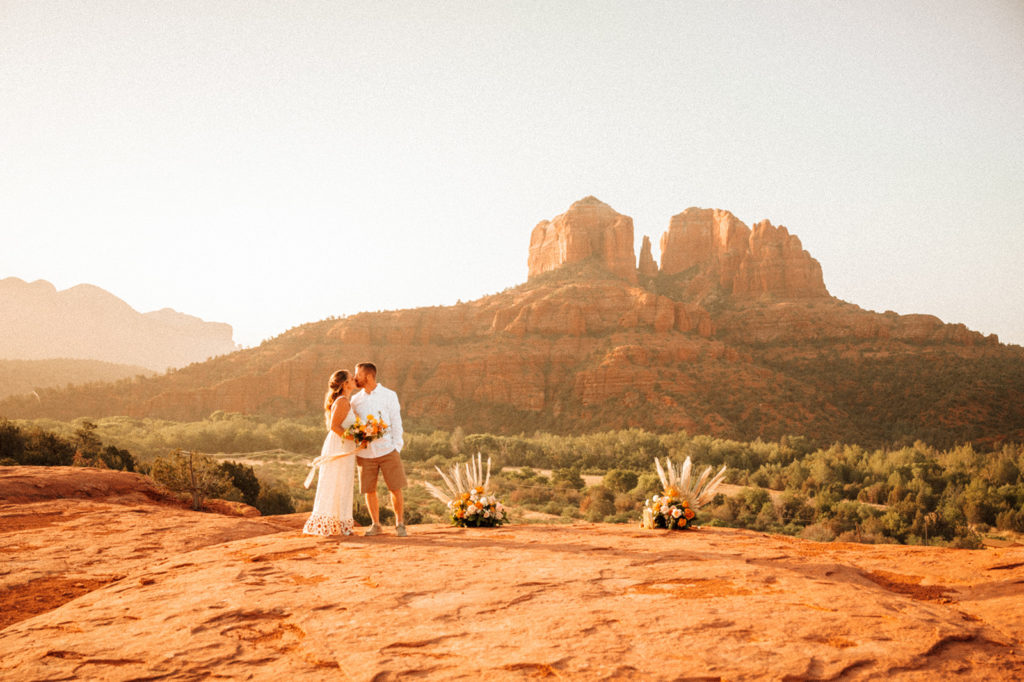Couple kissing and posing for photos after elopement in Arizona
