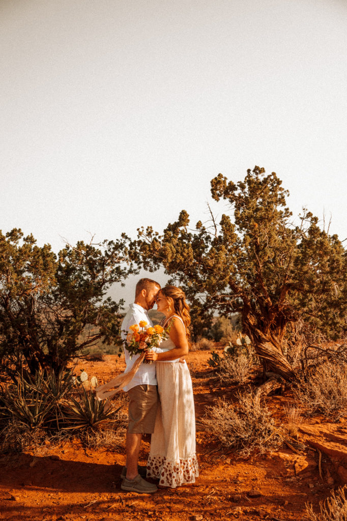 Couple posing for photos after elopement in Arizona