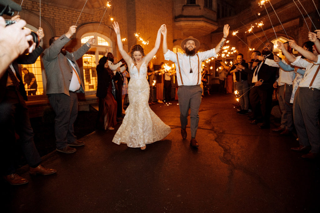Bride and grooms sparkler exit at Laurel Hall photographed by Sweet Caroline Photographer - Indianapolis wedding photographer