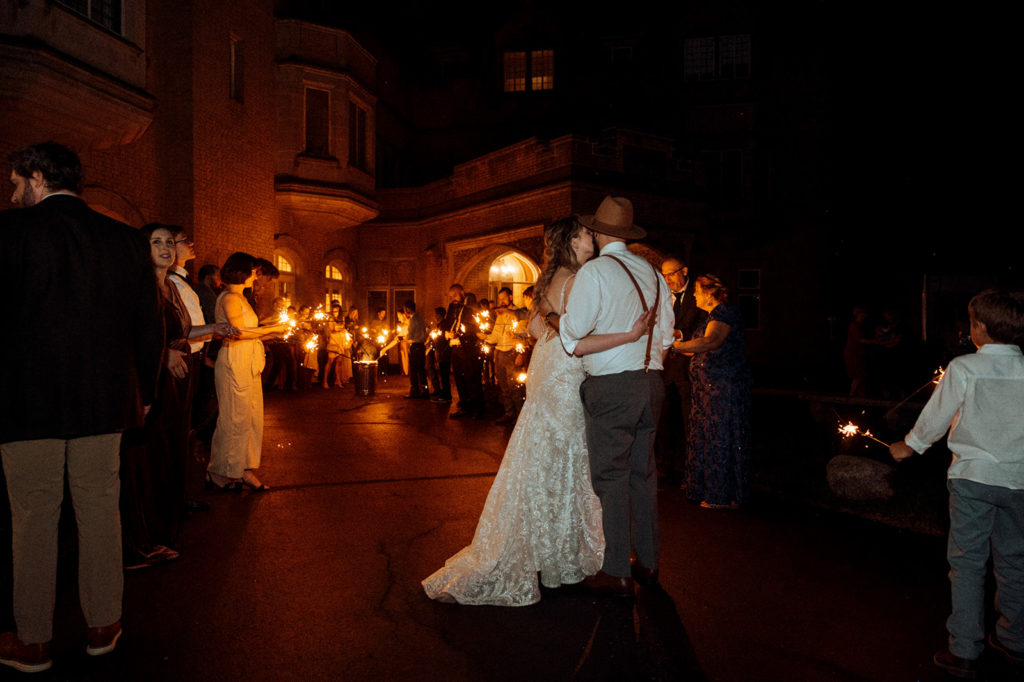 Bride and grooms sparkler exit at Laurel Hall photographed by Sweet Caroline Photographer - Indianapolis wedding photographer