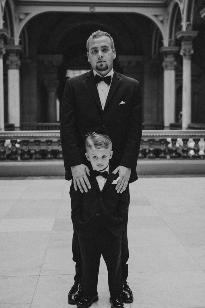 Groom posing with his son